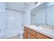 Clean bathroom with tub, shower, toilet and wood vanity at 37650 Aaralyn Rd, Zephyrhills, FL 33542