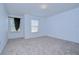 Spacious bedroom with neutral walls and carpet at 37650 Aaralyn Rd, Zephyrhills, FL 33542