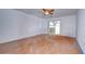 Spacious bedroom with wood flooring and sliding glass doors at 37650 Aaralyn Rd, Zephyrhills, FL 33542