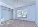 Bright bedroom featuring a window and closet at 37650 Aaralyn Rd, Zephyrhills, FL 33542
