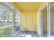 Empty screened patio with access to the backyard at 37650 Aaralyn Rd, Zephyrhills, FL 33542