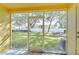 Screened patio overlooking a backyard with a view of trees at 37650 Aaralyn Rd, Zephyrhills, FL 33542