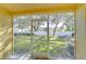 Screened patio overlooking a backyard with a view of trees at 37650 Aaralyn Rd, Zephyrhills, FL 33542