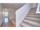 Simple staircase with carpeted steps and wood flooring at 37650 Aaralyn Rd, Zephyrhills, FL 33542