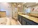 Bathroom with a corner shower, soaking tub, and granite countertops at 3909 W Eden Roc Cir, Tampa, FL 33634