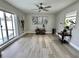 Large common area with sliding doors opening to a pool view at 3909 W Eden Roc Cir, Tampa, FL 33634