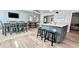 Bright dining area with light wood floors and modern decor adjacent to kitchen at 3909 W Eden Roc Cir, Tampa, FL 33634