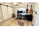 Bright home office features wood floors, built-in desk, and barn door at 3909 W Eden Roc Cir, Tampa, FL 33634