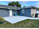 Private patio with seating area adjacent to the pool at 3909 W Eden Roc Cir, Tampa, FL 33634