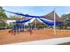 Community playground with shade structures at 3909 W Eden Roc Cir, Tampa, FL 33634