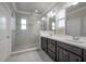 Bathroom boasts double vanity, large shower, and window at 5924 Village Center Dr, Lithia, FL 33547