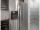 Stainless steel refrigerator and pantry access in kitchen at 5924 Village Center Dr, Lithia, FL 33547