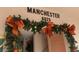 Decorated condo entry with festive garland at 6025 Shore S Blvd # 405, Gulfport, FL 33707