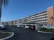 Condo building with parking and water view at 6025 Shore S Blvd # 405, Gulfport, FL 33707