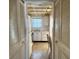Small kitchen with white cabinets and appliances at 6025 Shore S Blvd # 405, Gulfport, FL 33707
