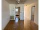 Living room with wood floors and access to kitchen at 6025 Shore S Blvd # 405, Gulfport, FL 33707