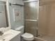 Clean bathroom with a shower, toilet, and vanity at 647 White Pine Tree Rd # 34, Venice, FL 34285