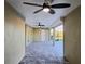 Spacious covered patio with tile flooring and ceiling fans at 8610 Quinn Ct, North Port, FL 34287