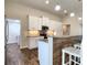 Modern kitchen with island, stainless steel appliances, and granite countertops at 8610 Quinn Ct, North Port, FL 34287