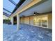 Covered patio with paver tile and access to the pool at 8610 Quinn Ct, North Port, FL 34287