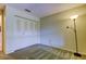 Bright bedroom with double door closet and floor lamp at 8727 Huntfield St, Tampa, FL 33635