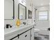 Elegant bathroom with double vanity and marble shower at 936 Lyndhurst St, Dunedin, FL 34698