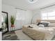 Main bedroom with a king-size bed and plush carpet at 936 Lyndhurst St, Dunedin, FL 34698