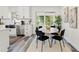 Kitchen dining area with a round table and modern chairs at 936 Lyndhurst St, Dunedin, FL 34698