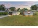Charming ranch home with a well-manicured lawn and updated facade at 936 Lyndhurst St, Dunedin, FL 34698