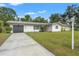 A home with a well-maintained front yard and driveway at 936 Lyndhurst St, Dunedin, FL 34698