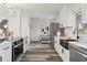 Updated kitchen with stainless steel appliances and breakfast nook at 936 Lyndhurst St, Dunedin, FL 34698