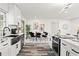 Modern kitchen with white shaker cabinets and a farmhouse sink at 936 Lyndhurst St, Dunedin, FL 34698