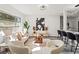 Bright living room with a neutral color palette and ample natural light at 936 Lyndhurst St, Dunedin, FL 34698