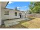 A concrete patio area next to the house at 936 Lyndhurst St, Dunedin, FL 34698