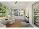 Bright sunroom with windows overlooking the yard at 936 Lyndhurst St, Dunedin, FL 34698