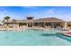 Inviting community pool with lounge chairs and cabana at 10810 Patoka Ter, Parrish, FL 34219