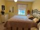 Spacious bedroom with a king-size bed and dresser at 1139 Woodleaf Ct, Palm Harbor, FL 34684