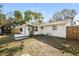 Private backyard with patio and wooden fence at 1172 Fernwood Dr, Holiday, FL 34690