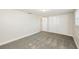 Spacious bedroom with new carpet and double door closet at 1172 Fernwood Dr, Holiday, FL 34690