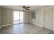 Spacious bedroom with tile floors and sliding glass door at 1172 Fernwood Dr, Holiday, FL 34690