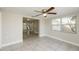 Bright bedroom with tile floors and large windows at 1172 Fernwood Dr, Holiday, FL 34690