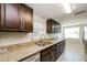 Modern kitchen with stainless steel appliances and granite countertops at 1172 Fernwood Dr, Holiday, FL 34690