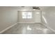 Spacious living area with tile floors and an exterior door at 1172 Fernwood Dr, Holiday, FL 34690