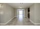 Open concept living area with tile floors and views to kitchen at 1172 Fernwood Dr, Holiday, FL 34690