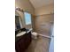 Bathroom with shower, toilet and granite vanity at 11847 Skylake Pl # D, Tampa, FL 33617
