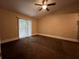 Spacious bedroom with carpet flooring and sliding door to balcony at 11847 Skylake Pl # D, Tampa, FL 33617