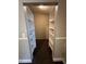 Spacious walk-in closet with built-in shelves and hanging rods at 11847 Skylake Pl # D, Tampa, FL 33617