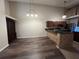 Bright dining area with hardwood floors and kitchen access at 11847 Skylake Pl # D, Tampa, FL 33617