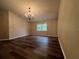 Bright dining room with laminate flooring and chandelier at 11847 Skylake Pl # D, Tampa, FL 33617