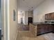 Kitchen with granite countertops and dark brown cabinets at 11847 Skylake Pl # D, Tampa, FL 33617